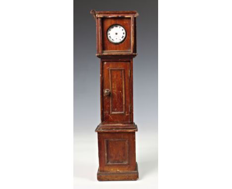 A novelty miniature longcase clock pocket / fob watch stand, of typical form but in miniature, the lid lifting off to place w