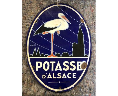 Advertising - Enamel sign 'Potasse d'Alsace', of oval form, blue ground, illustrated with the stork by Hansi, 23 5/8in. (60cm