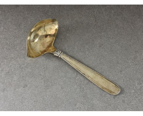 Jens Sigsgaard - a vintage Danish silver sauce ladle, c.1932, the ladle with foliate band and ribbon thread design to handle,