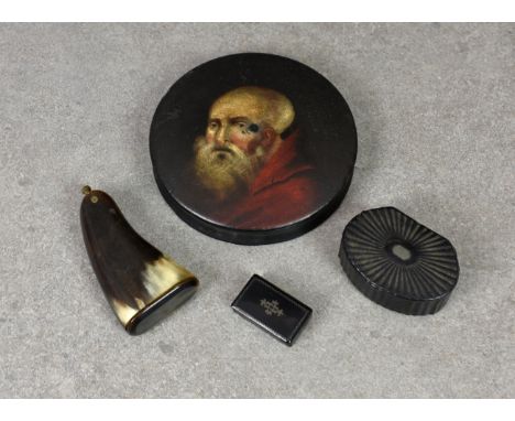 A 19th Century circular papier mache snuff box, the lid decorated with a portrait of a bearded gentleman, 4in. (10.2cm.) diam