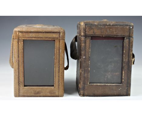 Two carriage clock morocco leather travelling cases, both of typical form with front window, the larger opening to reveal pur