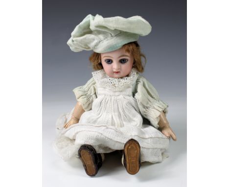 A French Paris Jumeau / Danel &amp; Cie Bébé bisque head doll, hairline crack to forehead of bisque head, blue glass inset ey