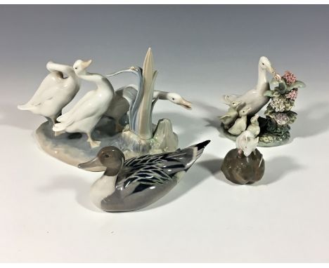 A small group of Royal Copenhagen and Lladro porcelain figurines, comprising of Royal Copenhagen duck, number 1933; mouse on 