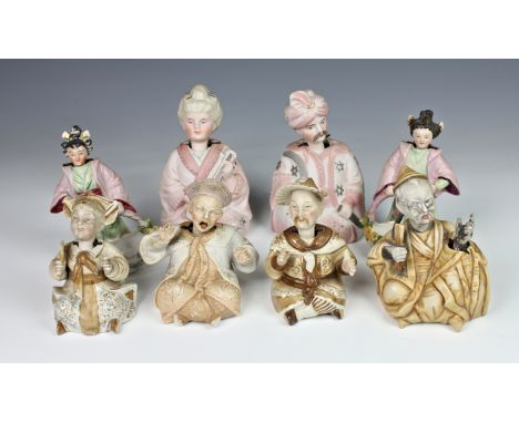 A small collection of Continental nodding head pagoda figures, comprising of a pair of Chinese porcelain standing female figu