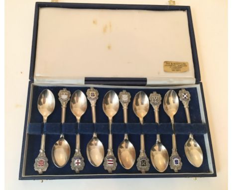 A cased set of ten silver plate &amp; enamel Guernsey parish teaspoons., 