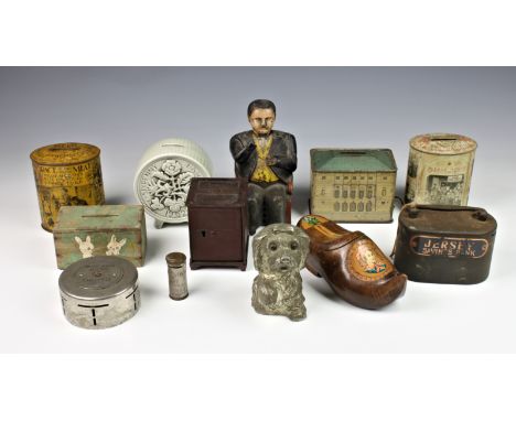 A collection of vintage and antique money boxes / banks, including a 19th century North American novelty cast iron 'Tammany B