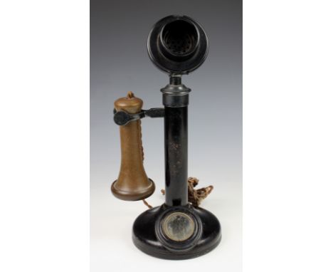 An Edwardian candlestick telephone, the bakelite receiver stamped TE 234 No. 22, the metal stand stamped PX24 over 234 and No