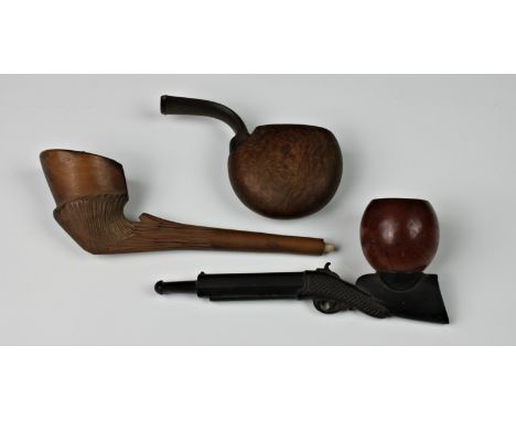 Three novelty smoking pipes, comprising of a pipe fashioned as a rifle 'The Defender'; horse hoof and a pocket pipe. (3)
