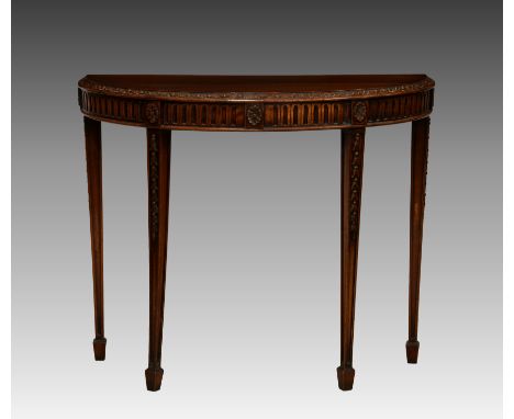 A George III style mahogany demi-lune console table, mid-20th century, with foliate carved border and arcaded frieze, raised 