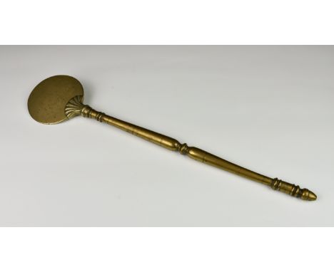 A very rare 18th century English or Dutch hand forged brass salamander, the turned handle with acorn finial and the disc brow