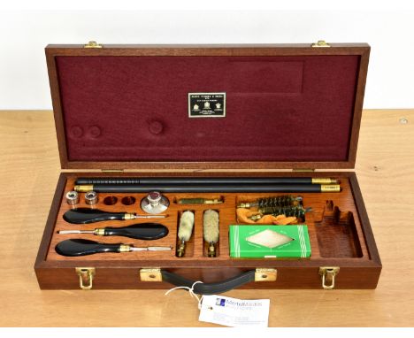 James Purdey &amp; Sons Ltd - A near complete cased presentation gun cleaning kit, with cleaning rod, chamber brushes, oil bo