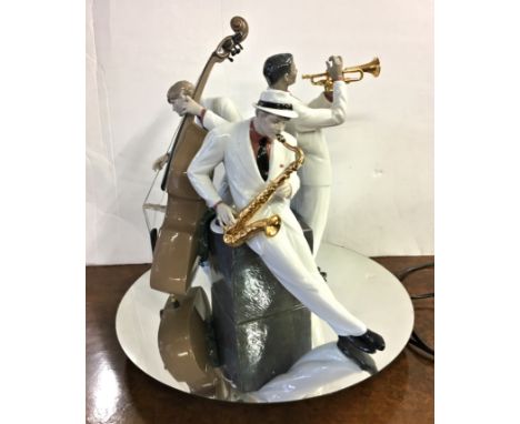 A large porcelain limited edition Lladro 'Jazz Trio', issued 2011, glossy porcelain figurine of three musicians with their in