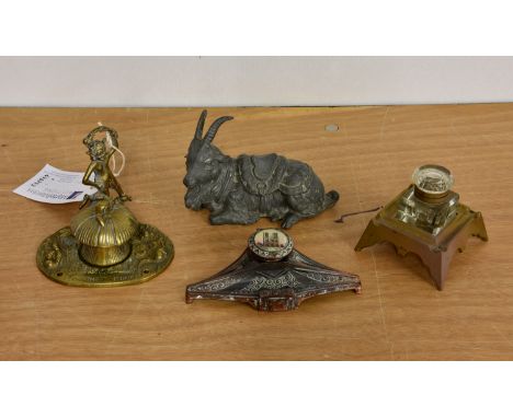 A collection of vintage and antique inkwells, to include a spelter inkwell fashioned as a goat, the hinged back / saddle open