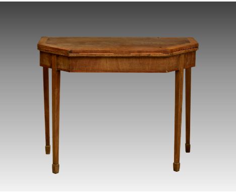 A late Regency cross banded mahogany foldover card table, the satinwood banded rectangular top with cut corners, raised on sq