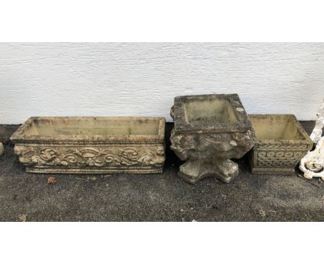 A composite stone planter, of shaped square form with lion mask corners, 15¾in. (40cm.) high, together with a sandstone troug