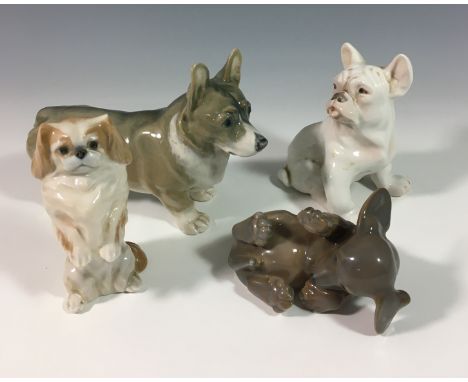 A small collection of Royal Copenhagen &amp; Bing &amp; Grondahl dog figurines, comprising of Corgi - 4593, 7in. (17.8cm.) lo