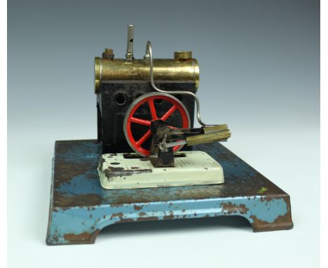 A vintage stationary live steam engine, with anvil, grinder &amp; buffer accessories, unsigned, 8 x 8in. (20.4 x 20.4cm.).