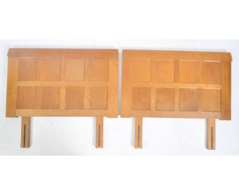 Robert ' Mouseman ' Thompson of Kilburn - A pair of solid English oak hand carved single headboards. Each headboard having a 