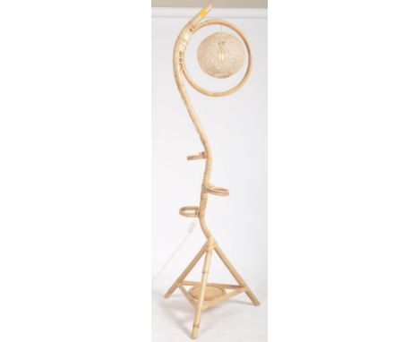 A retro vintage 20th century Daro Ltd bamboo wicker floor standing lamp stand. The lamp having a serpentine main structure wi