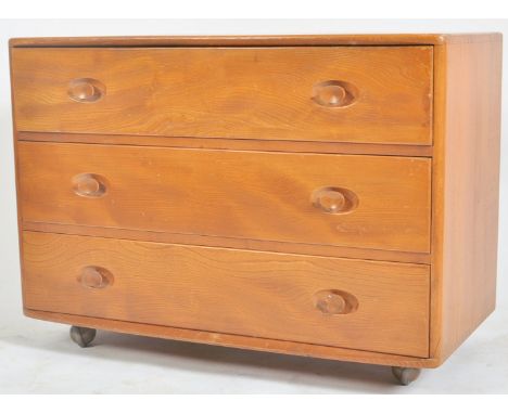 Lucian Ercolani for Ercol - Windsor Range - A retro mid century elm chest of drawers having a bank of three long drawers. Eac