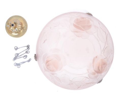 An Art Deco 20th century circa 1930s opaque pink glass ceiling pendant light shade. The glass moulded shade decorated with th