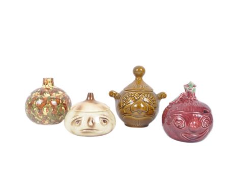 A collection of four vintage 20th century British pottery ceramic vegetable shaped condiments jars. The lot comprising of two