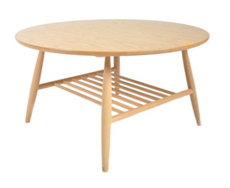 Ercol - Shalstone - A contemporary designer solid oak coffee table / low table having a circular table top with spindle magaz