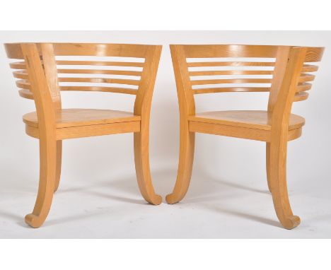 A pair of retro vintage 20th century teak conservatory patio tub armchairs / chairs. Each armchair having a ladder curved bac