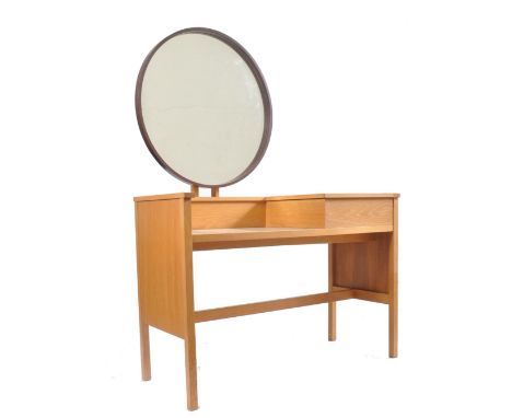 G Plan - Young Ideas Range - A retro 20th century light oak dressing table desk having a teak framed circular mirror over a d