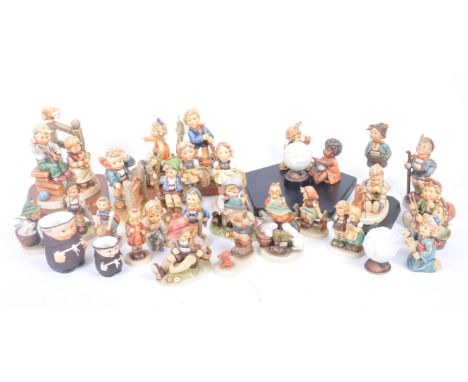 M. J. Hummel by Goebel - A large collection of vintage 20th century Goebel porcelain china figurines. The lot comprising a Mi