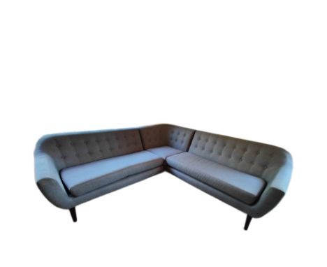 A contemporary Made.com modular corner L shaped sofa settee. The sofa in a grey upholstery with buttoned back over rounded el