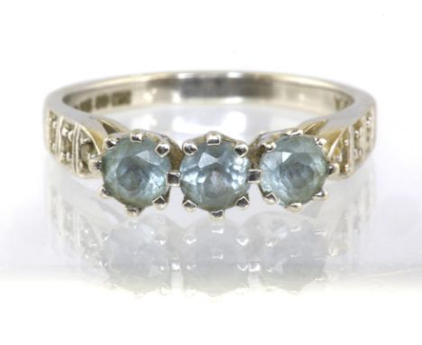 Three stone blue topaz ring with diamond shoulders, set in 9ct white gold, ring size MCondition Report:  2.7 grams