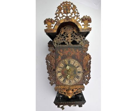 A Dutch Freise Stoel clock, late 19th/early 20th Century, with pierced armorial cresting,, the dial decorated with boys and c