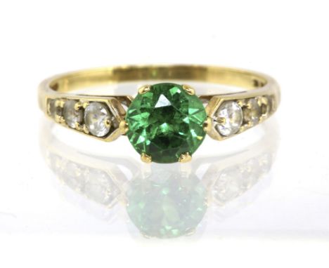 Single stone green paste ring with paste shoulders, claw set in stamped 14ct, ring size S½Condition Report:  3 grams