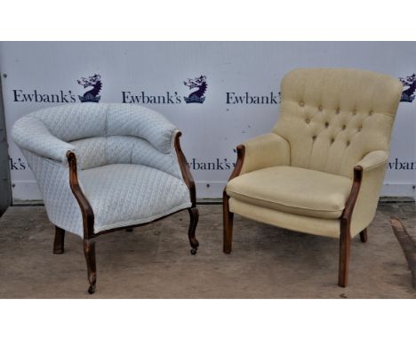 Edwardian armchair, with overstuffed seat and back, on brass casters, 69cm high, with another cream upholstered armchair, but