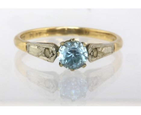 Single stone blue topaz ring with diamond shoulders, in stamped 9ct and platinum, ring size NCondition Report:  1.8 grams