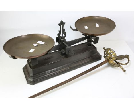 A set of vintage scales, cast iron base. And a vintage reproduction rapier.