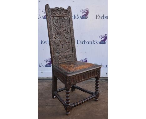 Oak single chair, 19th Century, the back with shallow relief carving of birds and stylised designs, above leather pad seat, o