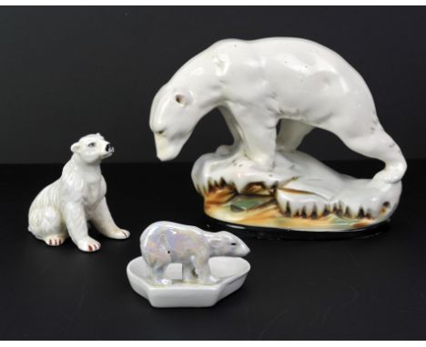 Two Royal Copenhagen plates decorated with polar bears, 12.5cm diameter, together with various models of bears, lamps with be