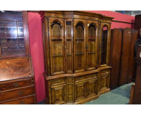 An American mid 20th Century oak Hibriten for Bernhardt, North Carolina bow fronted display bookcase, with four glazed panel 