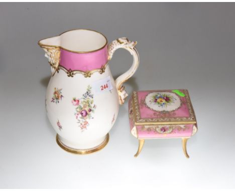 An 18th Century Worcester style porcelain jug with mask spout and griffon handle decorated with sprays of flowers, together w