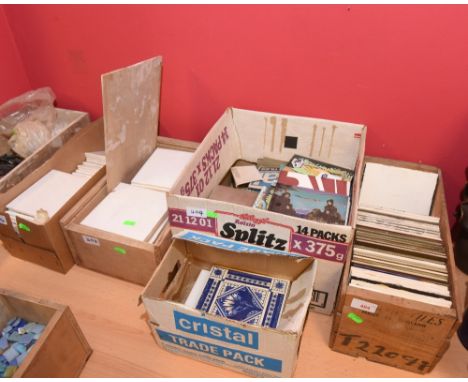 Five boxes of plain and hand painted ceramic tiles