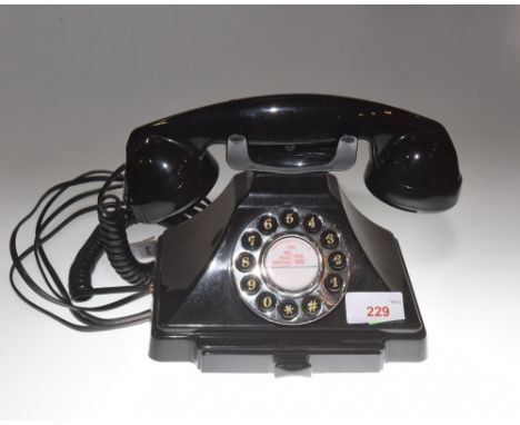 A Vintage style black bakelite telephone 