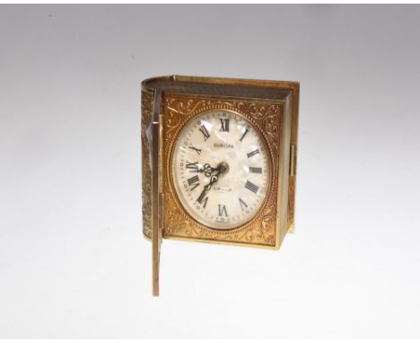 A German Europa book alarm clock, the hinged front opening to reveal the clock and a photograph frame