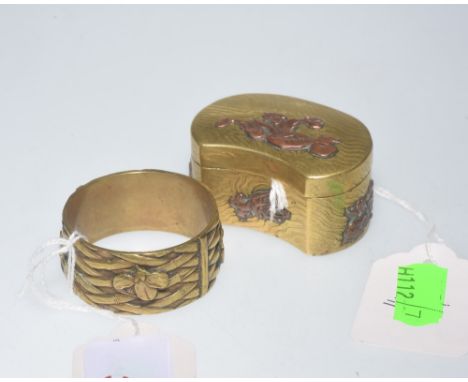 An Oriental brass napkin ring tog. with a brass snuff box of similar origin (2)