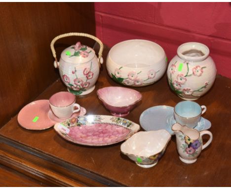 A large group of Maling ware china including a biscuit barrel with swing handle, a vase and bowl each decorated with pink flo