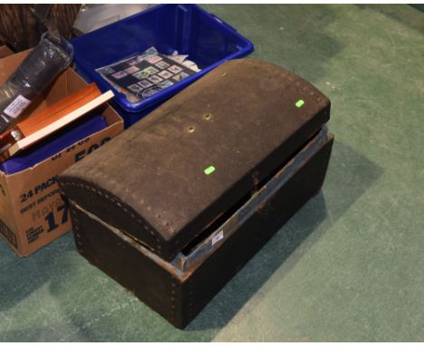 A vintage dome topped trunk containing pewter, brass etc
