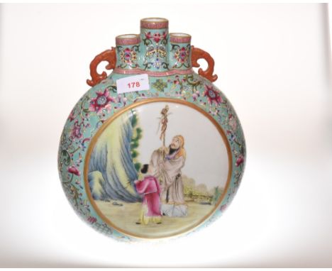 A Chinese porcelain famille rose moon flask vase, decorated with figures and with four character mark to base.