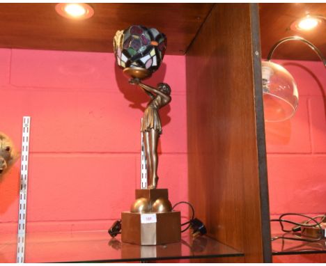An Art Deco style figural lamp with coloured glass shade