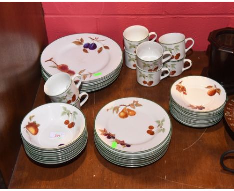 A Royal Worcester 'Evesham Vale' fruit pattern dinner service comprising six dinner plates, eight dessert plates, eight bowls